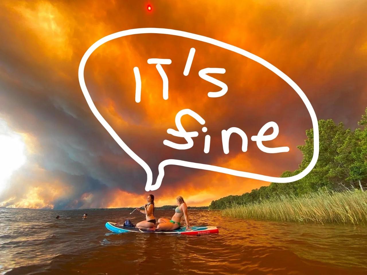 two girls on sub in sea with giant fire lit up sky in the background