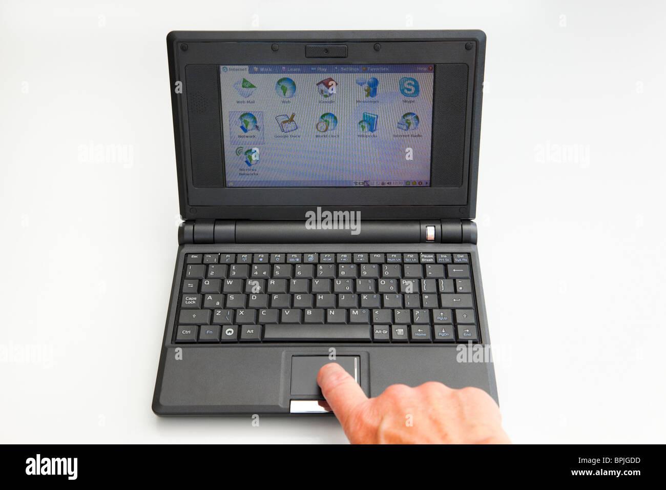 Eeepc from Asus, tiny laptop with touchpad, camera, mic and USB connectors.